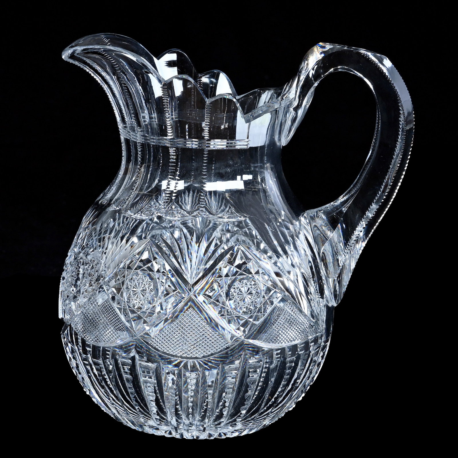 Water Pitcher, American Brilliant Cut Glass, Pluto Pattern By J. Hoare: Water Pitcher, American Brilliant Cut Glass, Pluto Pattern By J. Hoare, 7.5 x 6.75 x 5 Inches, Solid Notched Handle, Ray Cut Base, Pattern Chip, 3.3 Pounds, Private Collection, New Jersey. Effective 6