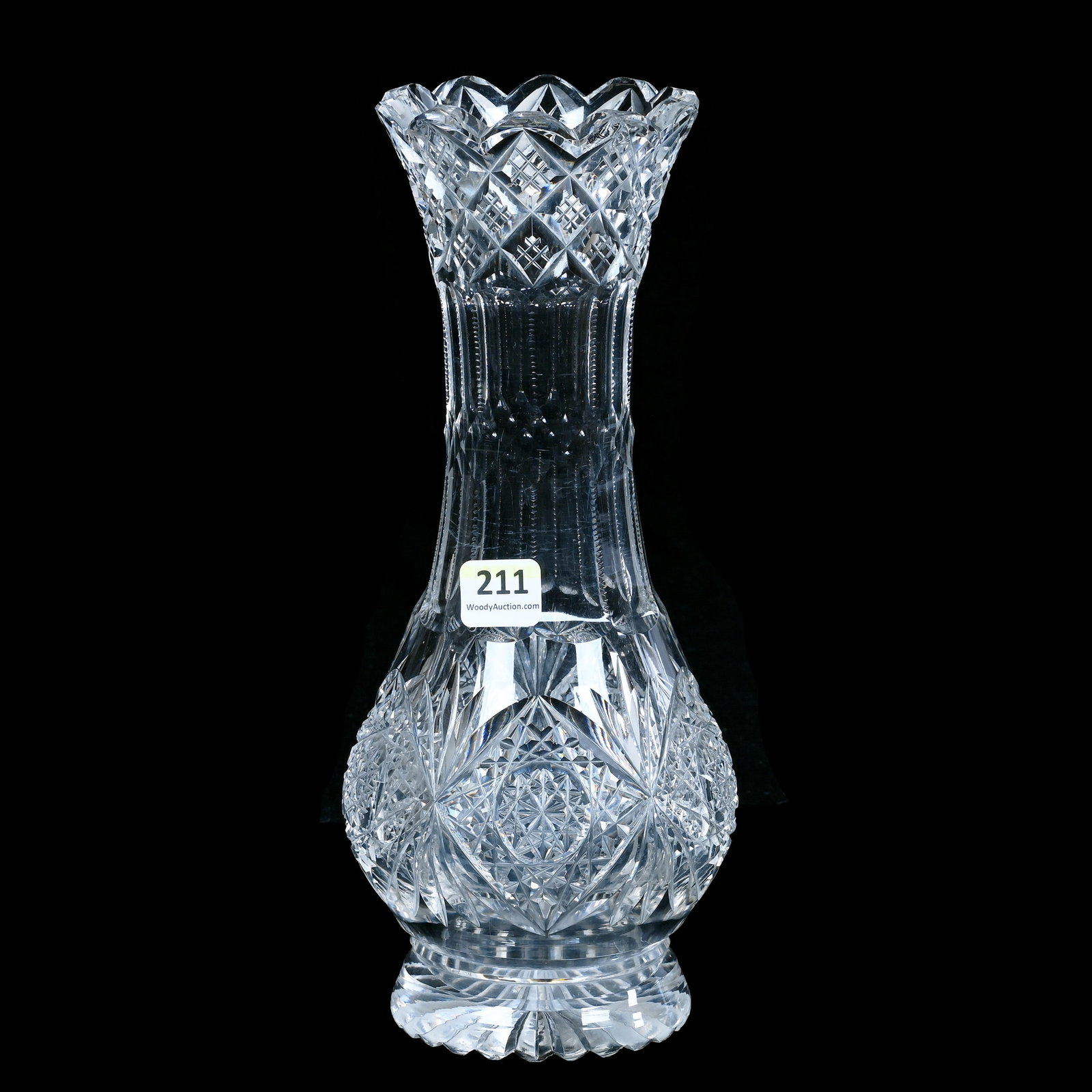 Vase, American Brilliant Cut Glass: Vase, American Brilliant Cut Glass, 10 x 4.25 x 4.25 Inches, Hobstar And Fan Motif, Thick Ray Cut Base, Rim Chip And Base Bruise, 2.7 Pounds, Mitchell Caughman Collection, Colorado. Effective 6/6/26, 