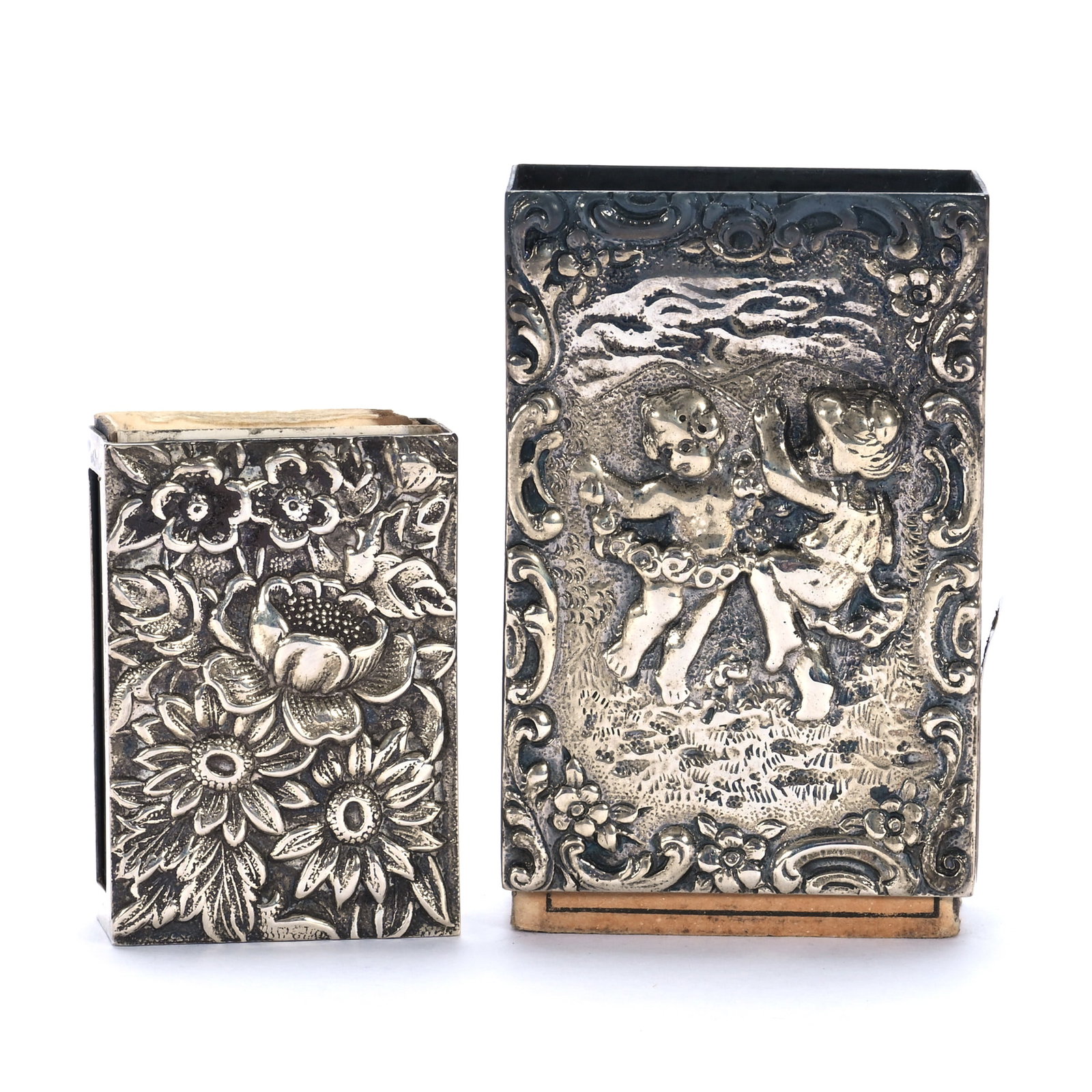 (2) Matchbox Holders, Sterling Silver: (2) Matchbox Holders, Sterling Silver, 2.25 x 1.5 x 0.75 Inches, (1) Marked Marshall Field And Company With Embossed Cherub Design, (1) Marked S. Kirk And Son With Floral Repousse, 60 Grams, Mitchell 