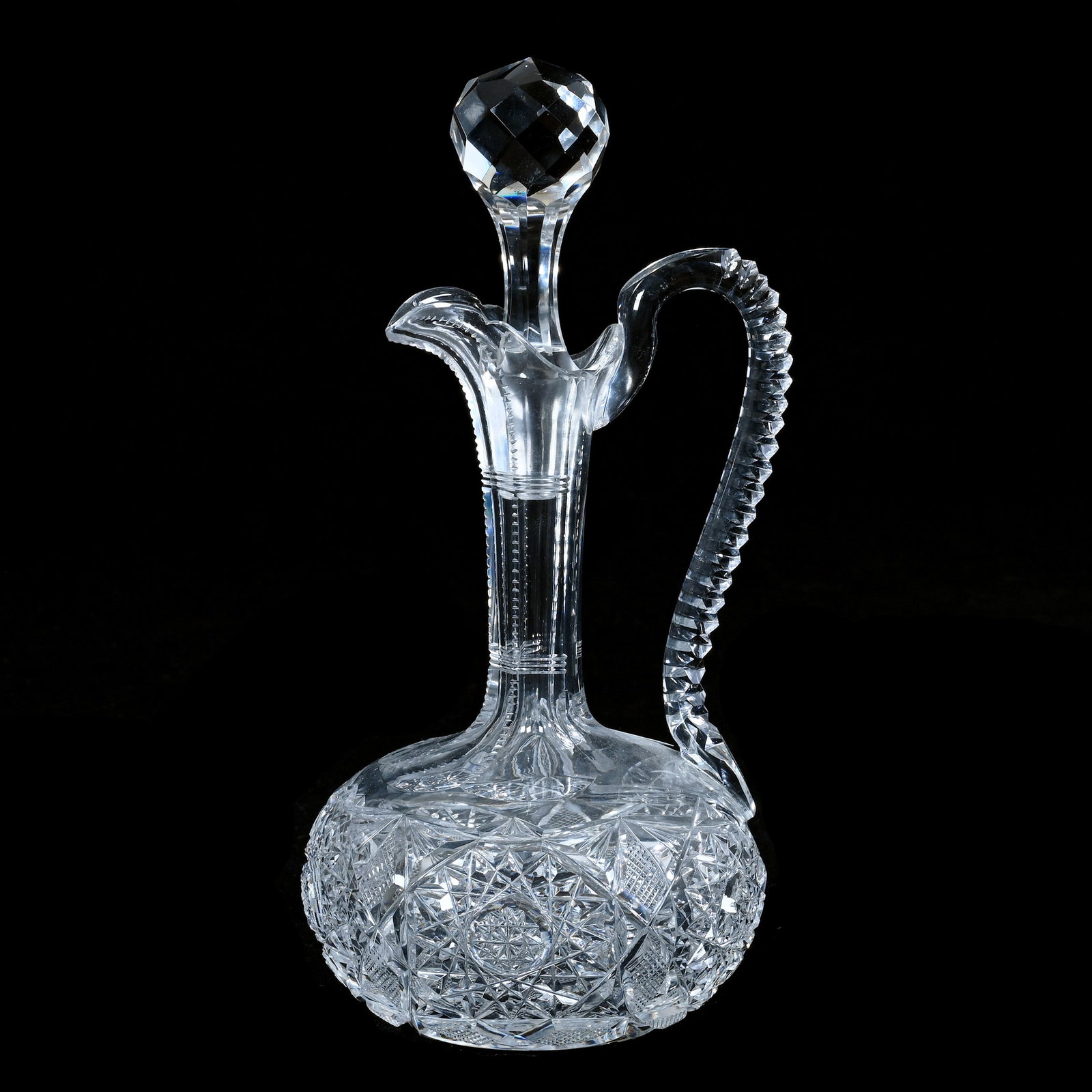 Cruet, American Brilliant Cut Glass, Jubilee Pattern By Straus: Cruet, American Brilliant Cut Glass, Jubilee Pattern By Straus, 8.5 x 4 x 4 Inches, Notched Handle, Hobstar Base, 1.5 Pounds, Mitchell Caughman Collection, Colorado. Effective 6/6/26, All LiveAuctione