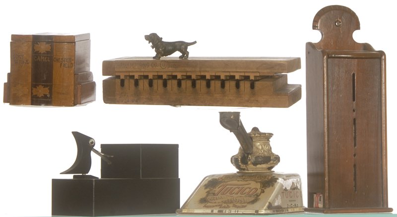 BOX OF SMOKING MEMORABILIA: BOX OF SMOKING MEMORABILIA INCLUDES (3) CIGARETTE DISPENSERS - (1) TOBACCO ADVERTISING CUTTER - (1) WOODEN CIGAR MOLD DATED 1914