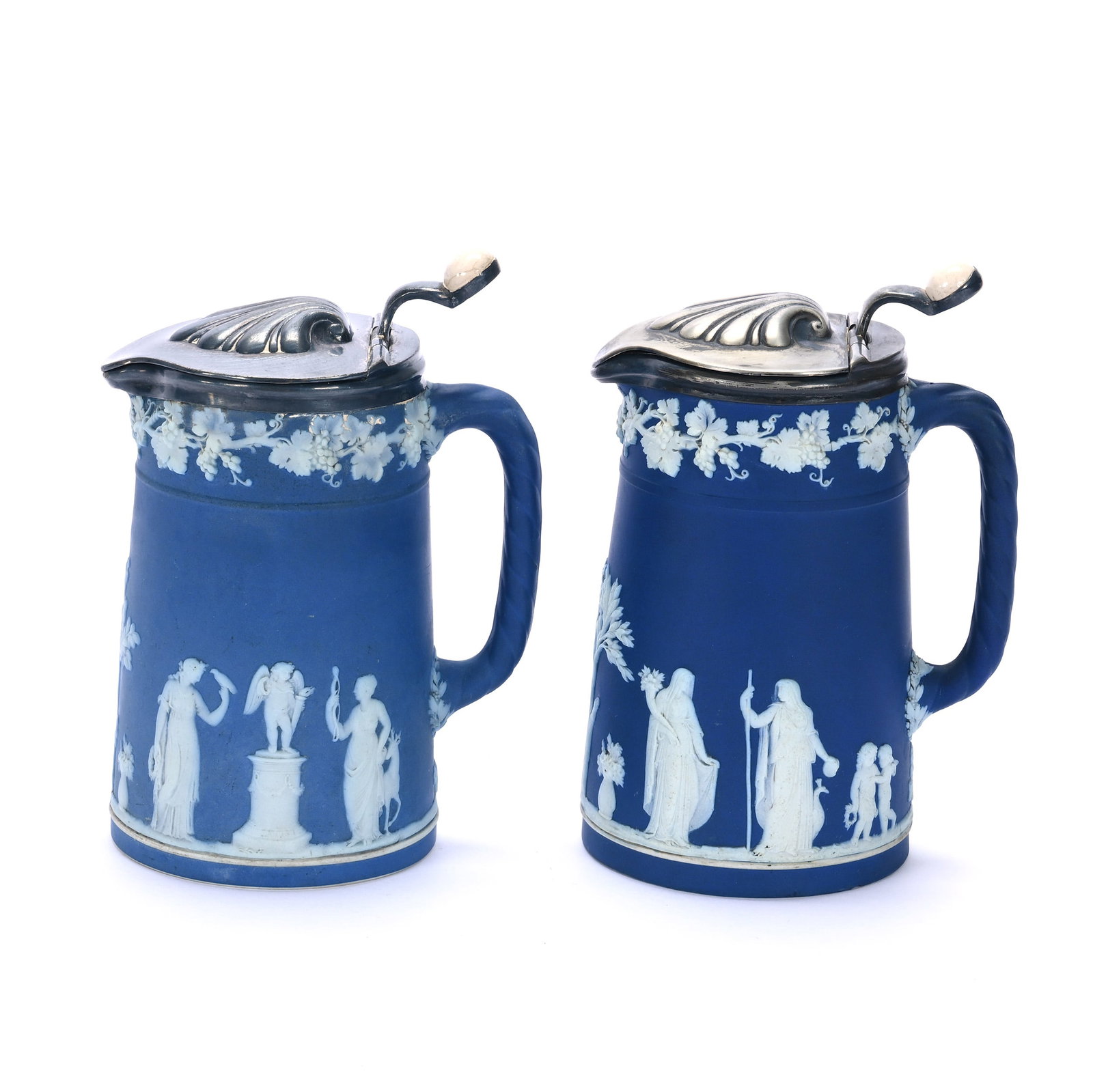 (2) Milk Jugs, Marked Wedgwood Jasperware: (2) Milk Jugs, Marked Wedgwood Jasperware, 6.25 x 4.5 x 3.25 Inches, Classic Blue And White Scenic Relief, Metal Flip Tops, 2.6 Pounds, John And Doris Carty Estate Collection, IA, Effective 6/6/26, Al