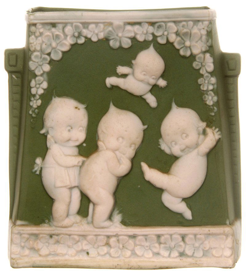 4" MARKED SCHAFER AND VATER "ROSE O'NEILL" SQUARE SHAPE: 4" MARKED SCHAFER AND VATER "ROSE O'NEILL" SQUARE SHAPED VASE GREEN WITH PINK RELIEF OF FOUR KEWPIES - small hairline flaw on right side