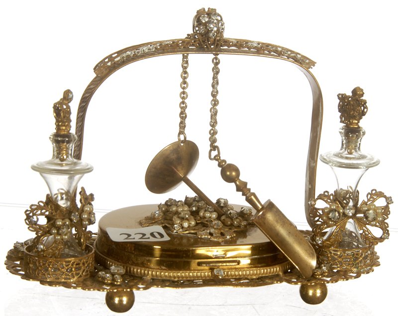 4" X 6" PERFUME SET: 4" X 6" PERFUME SET (2) CLEAR PERFUME BOTTLES SET IN FANCY GILT FRAME - MULTIPLE GARNETT JEWELED HIGHLIGHTS - CHAINED PERFUME FUNNEL AND SCOOP