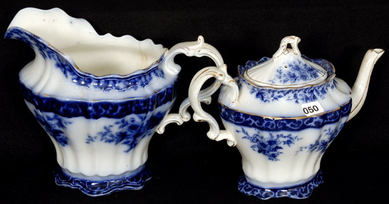 (2) PIECES FLOW BLUE TOURAINE PATTERN BY HENRY ALCOCK: (1) 7 3/4" PITCHER WITH OLD HAIRLINE - (1) 7" TEAPOT WITH SPOUT REPAIR