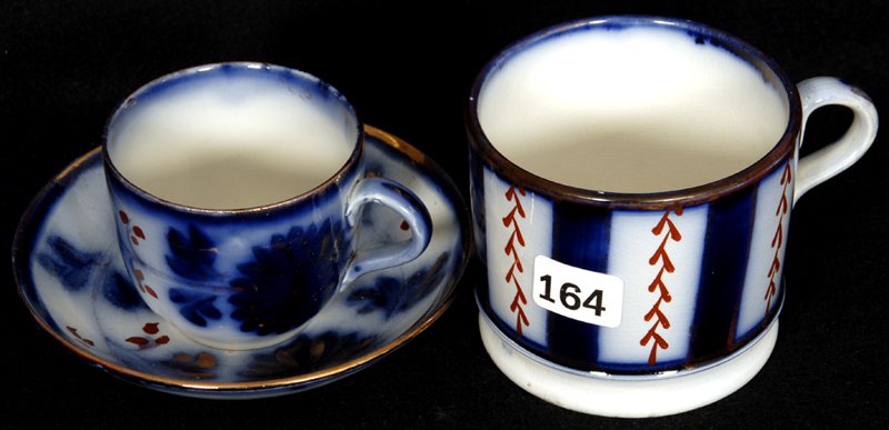 (2) FLOW BLUE CUPS & (1) SAUCER: (1) WITH FLORAL DESIGN - (1) WAGON WHEEL DESIGN