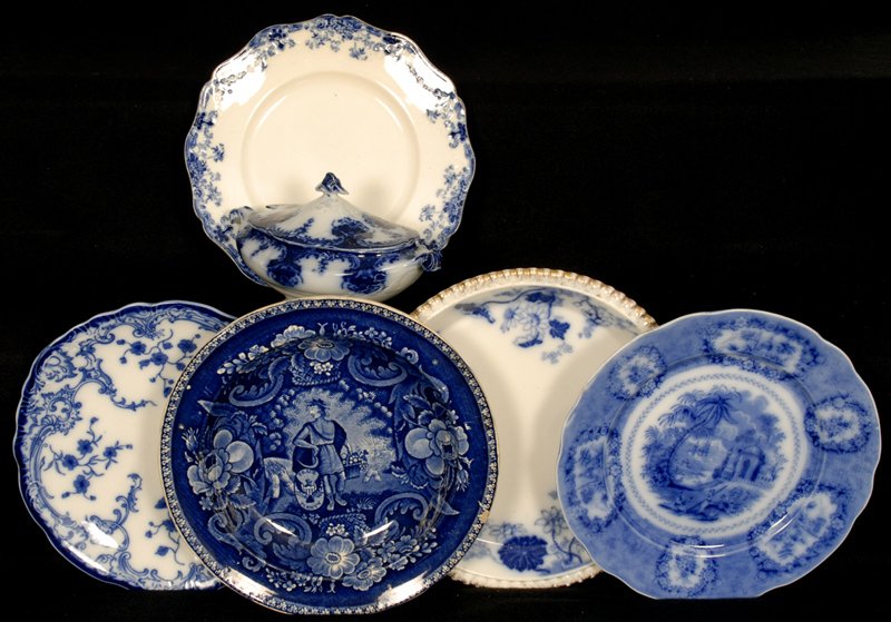 (6) FLOW BLUE ITEMS: (1) 9 1/2" ORIENTAL PLATE - (1) 9 3/4" LINDA PLATE - (1) 9 1/4" MARIE PLATE - (1) 10" LOTUS PIE PLATE - (1) COVERED SAUCE - (1) PEACE BRINGING PLENTY PLATE (RIM CHIP)