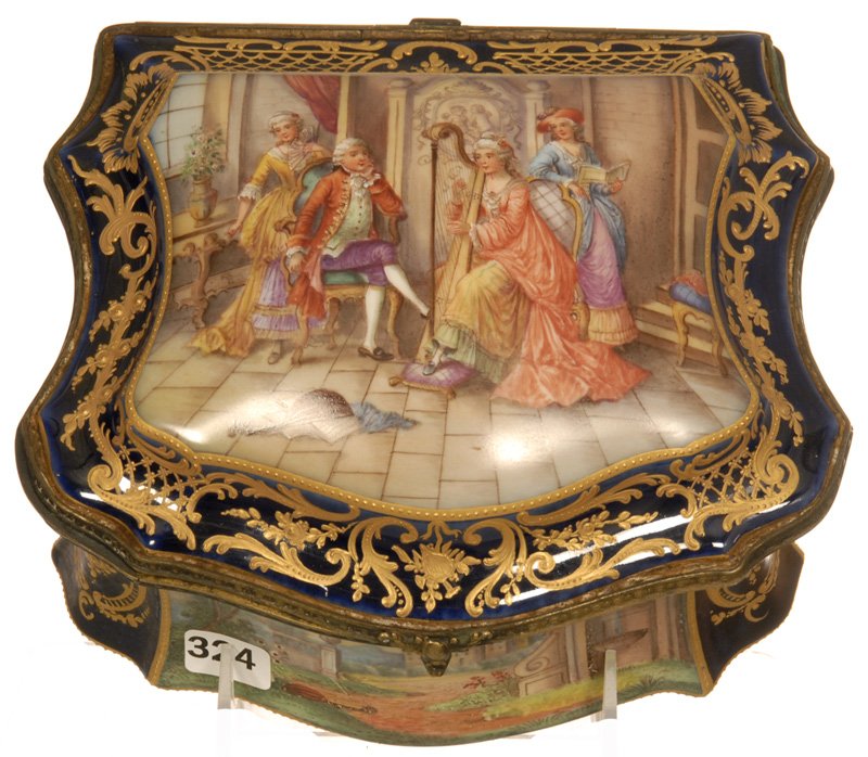 4 1/2" X 8" MARKED SEVRES FRENCH HINGED DRESSER BOX: 4 1/2" X 8" MARKED SEVRES FRENCH HINGED DRESSER BOX COBALT BLUE BORDER WITH GOLD ENAMEL HIGHLIGHTS SURROUNDING ELABORATE PALACE SCENES - WHITE INTERIOR WITH SCATTERED FLORAL DECORATIVE DECOR -