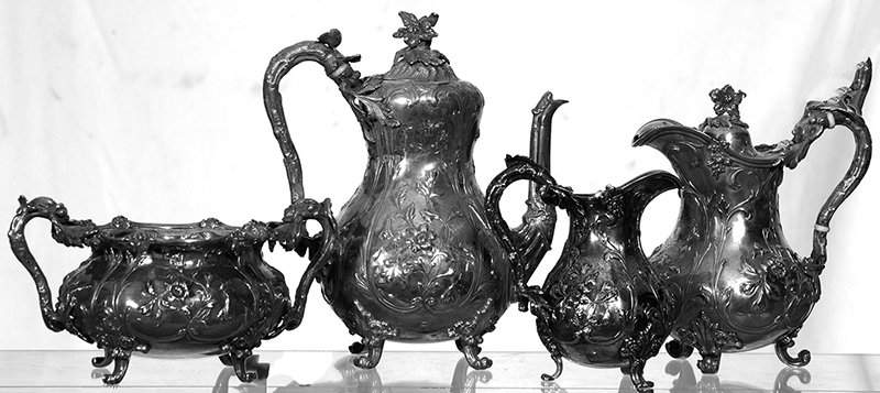 (4) PIECE STERLING SILVER TEA SERVICE: (4) PIECE STERLING SILVER TEA SERVICE - ENGLISH HUNT & ROSKELL LATE STORR, MORTIMER & HUNT #1907 - FINELY CHASED FLORAL DESIGN WITH "HEART AND HAND" CREST ENGRAVED ON EACH PIECE. OVER 96 TOTAL TROY OU