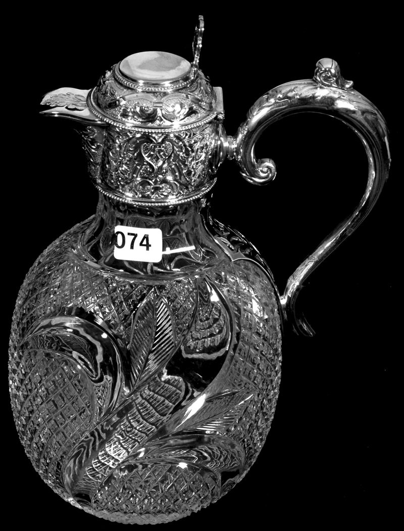 10" OVAL CUT GLASS CLARET JUG WITH SILVER FITTINGS: 10" OVAL CUT GLASS CLARET JUG WITH SILVER FITTINGS MARKED MARTIN & WEBB CROSSCUT DIAMOND BODY WITH UNIQUE CORN STALK DESIGN - EXTRA NICE - SILVER FITTINGS ARE AN ELABORATE EMBOSSED DESIGN
