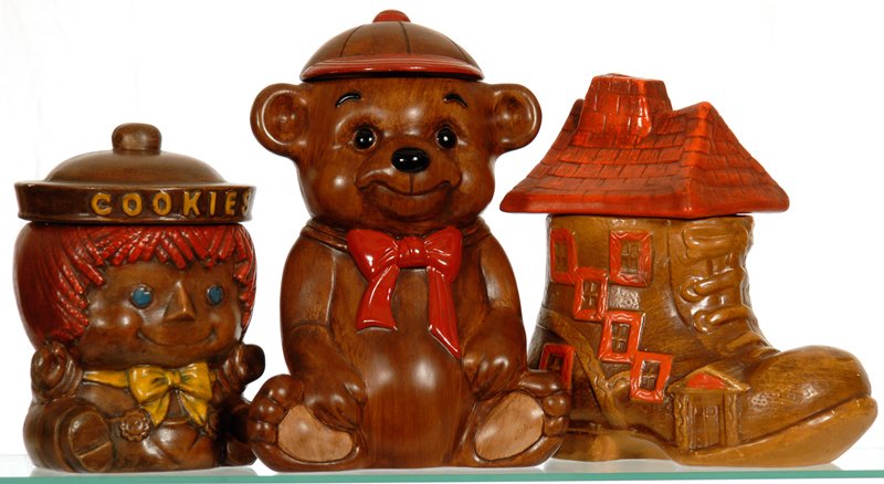 (3) FIGURAL COOKIE JARS: (3) FIGURAL COOKIE JARS BROWN TONES FEATURING - 12 1/2" TEDDY BEAR - 10 1/2" OLD LADY IN SHOE - 9 1/2" RAGGEDY ANN