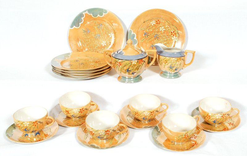 TWENTY PIECE SET OF DINNERWARE MADE IN JAPAN: TWENTY PIECE SET OF DINNERWARE MADE IN JAPAN BROWN AND BLUE LUSTRE WITH BIRD DECOR - (6) 7" PLATES - (6) CUPS AND SAUCERS - CREAMER AND SUGAR - ONE PLATE WITH RIM CHIP