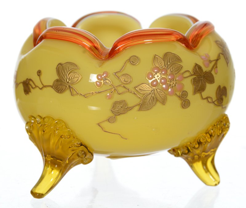 3 1/2" UNMARKED WEBB CASED YELLOW ART GLASS FOOTED BOWL: 3 1/2" UNMARKED WEBB CASED YELLOW ART GLASS FOOTED BOWL ENAMEL LEAF AND BLOSSOM DECOR - APPLIED ORANGE AND RED STRIPED RIM