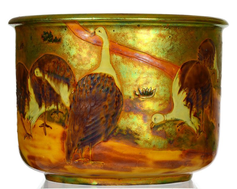 UNIQUE 10 1/2" X 14" MARKED ZSOLNAY ART POTTERY HIGHLY: UNIQUE 10 1/2" X 14" MARKED ZSOLNAY ART POTTERY HIGHLY IRIDESCENT JARDINIERE EIGHT EMU-LIKE BIRDS AROUND VASE IN FIELD AND TREE LANDSCAPE - SURPRISINGLY GOOD CONDITION - OLD HARD TO SEE HAIRLINE AT TO