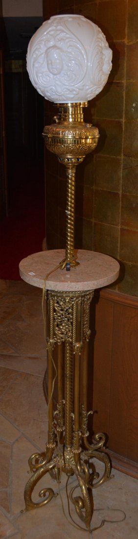 71" BRASS AND MARBLE ELECTRIFIED ORGAN LAMP: 71" BRASS AND MARBLE ELECTRIFIED ORGAN LAMP 4 HIGHLY DECRETIVE BRASS LEGS - ROUND MARBLE SHELF - MILK GLASS EMBOSSED CHERUB HEAD SHADE