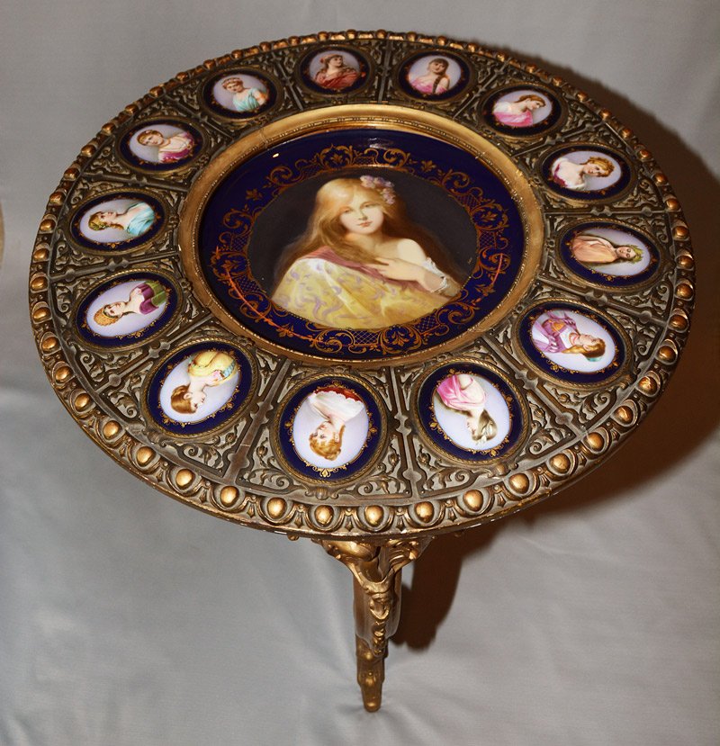 EXCEPTIONAL 31" X 27" THREE LEGGED GILT WOODEN PARLOR: EXCEPTIONAL 31" X 27" THREE LEGGED GILT WOODEN PARLOR TABLE MARKED BEEHIVE PORCELAIN INSERTS - 13" DIAMETER CENTER PLAQUE WITH YOUNG WOMAN PORTRAIT AND COBALT BLUE BORDER - 13 4" OVAL PORCELAIN MEDALL
