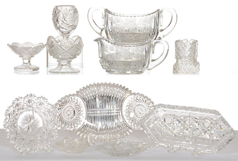 BOX LOT: BOX LOT (11) CUT GLASS ITEMS: TUTHILL CREAMER & SUGAR (HANDLE CHECK) - (1) SMALL SERVING DISH WITH RIM CHIP - (1) PEDESTAL TOOTHPICK HOLDER