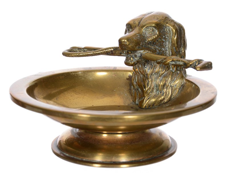 2 1/2" X 4" BRASS ASH TRAY WITH FIGURAL DOG'S HEAD: 2 1/2" X 4" BRASS ASH TRAY WITH FIGURAL DOG'S HEAD HOLDING RIDING CROP 2 1/2" X 4" BRASS ASH TRAY WITH FIGURAL DOG'S HEAD HOLDING RIDING CROP