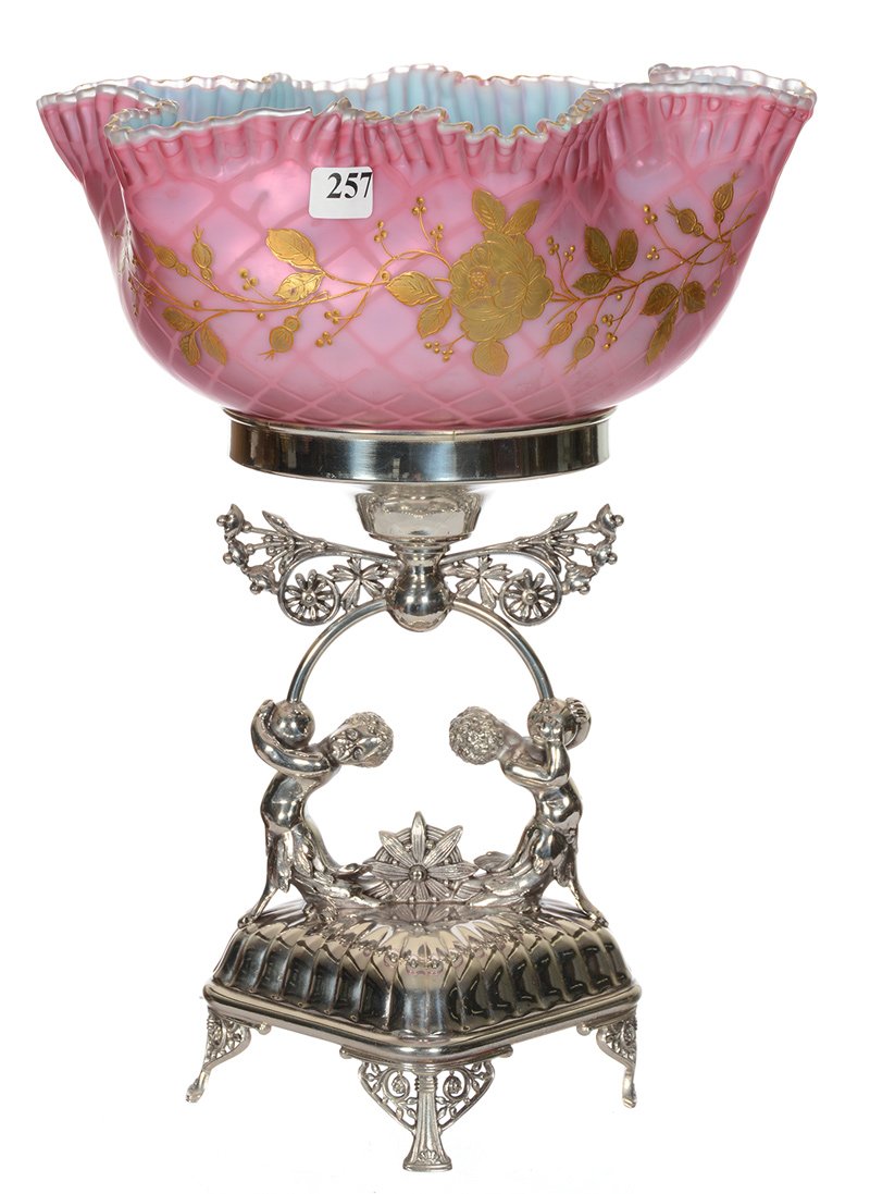 13 1/2" X 10" BRIDES BASKET: 13 1/2" X 10" BRIDES BASKET PINK SATIN DIAMOND QUILTED MOTHER OF PEARL ART GLASS BOWL WITH BLUE INTERIOR AND GOLD ENAMEL FLORAL DECOR - SET ON ORNATE MERIDEN SILVERPLATE BASE FEATURING TWO CHERUBS