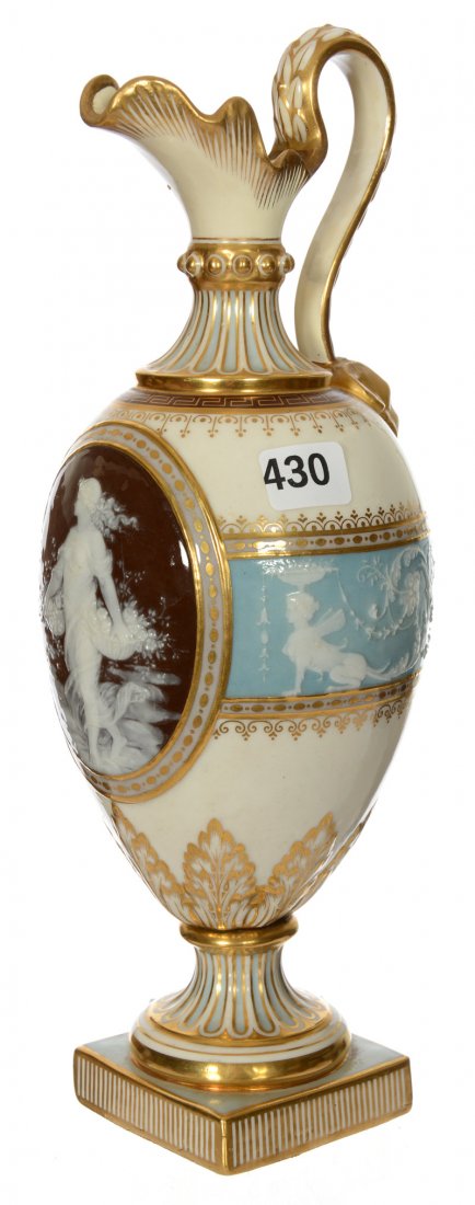 11" MARKED MINTON PEDESTAL HANDLED PATE-SUR-PATE EWER: 11" MARKED MINTON PEDESTAL HANDLED PATE-SUR-PATE EWER CREAM BACKGROUND WITH BLUE EMBOSSED BAND - BROWN MEDALLION WITH PATE-SUR-PATE RELIEF OF WOMAN CARRYING BASKET - DOES HAVE SIGNIFICANT PROFESSIONAL