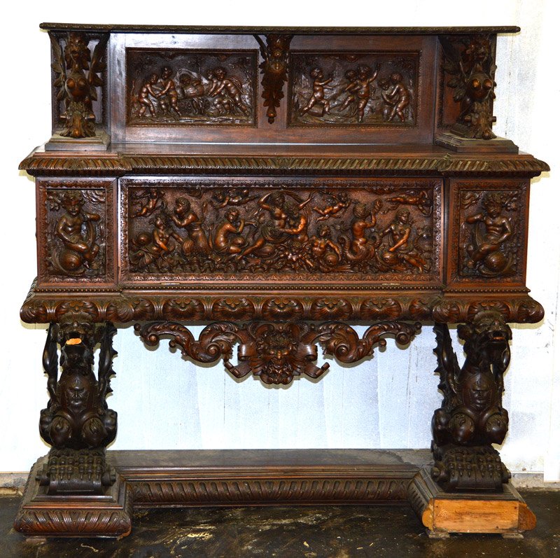 76" X 60" ENGLISH OAK SIDEBOARD: 76" X 60" ENGLISH OAK SIDEBOARD LARGE CARVED FIGURAL GRIFFIN LEGS WITH CARVED SCENES FEATURING CHERUBS AND WINE MAKERS - SOME GLUE ISSUES WITH TRIM PIECES - SMALL PIECES POSSIBLY CHIPPED OFF - BACK SU