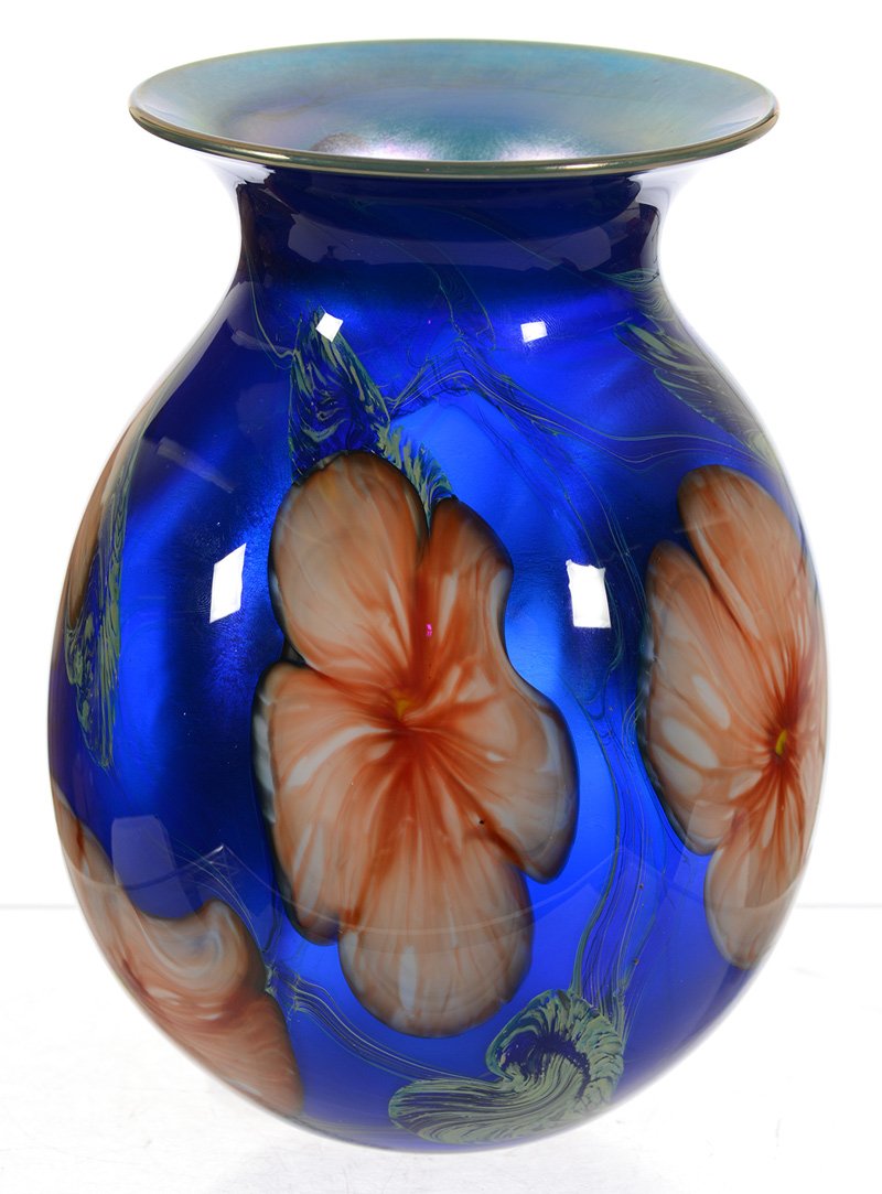 7 1/4" SIGNED CHARLES LOTTON "MULTI FLORA" GLASS VASE: 7 1/4" SIGNED CHARLES LOTTON "MULTI FLORA" ART GLASS VASE - BLUE BACKGROUND W/ WHITE & ORANGE BLOSSOM, GREEN HEART & VINE DECOR - DATED 1977
