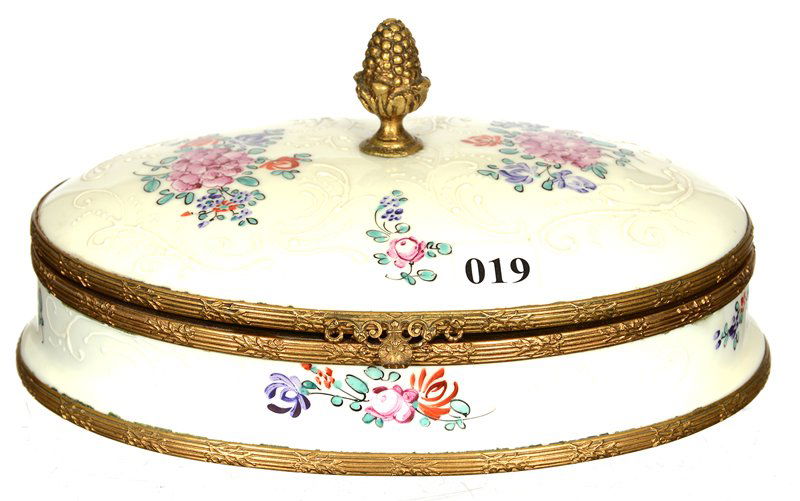4" X 8" FRENCH OVAL HINGED BOX: 4" X 8" FRENCH OVAL HINGED BOX WHITE PORCELAIN WITH HANDPAINTED FLORAL DECORATED AND ENAMEL HIGHLIGHTS - GILT METAL TRIM WITH FIGURAL ACORN FINIAL
