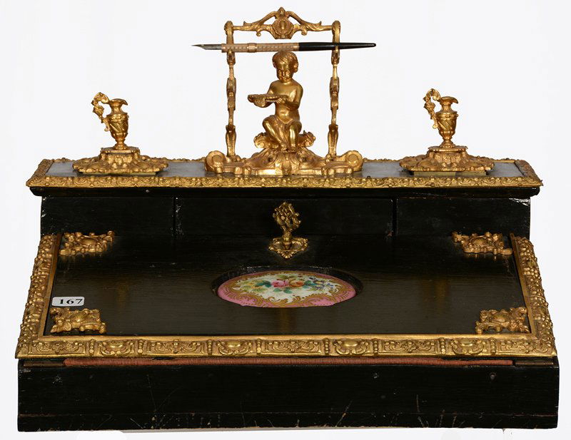 11" X 15" EARLY EBONY LAP DESK: 11" X 15" EARLY EBONY LAP DESK GILT METAL FITTINGS WITH FIGURAL CHERUB AND PEN HOLDER - HAND PAINTED PORCELAIN INSERT