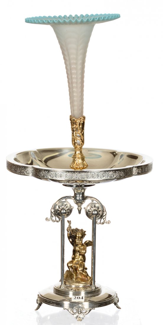 21" X 10 1/2" SIMPSON, HALL & MILLER SILVERPLATE: 21" X 10 1/2" SIMPSON, HALL & MILLER SILVERPLATE EPERGNE FEATURES A BLUE AND FROSTED ART GLASS LILY SET INTO GILT METAL HOLDER ABOVE GILT METAL CHERUB