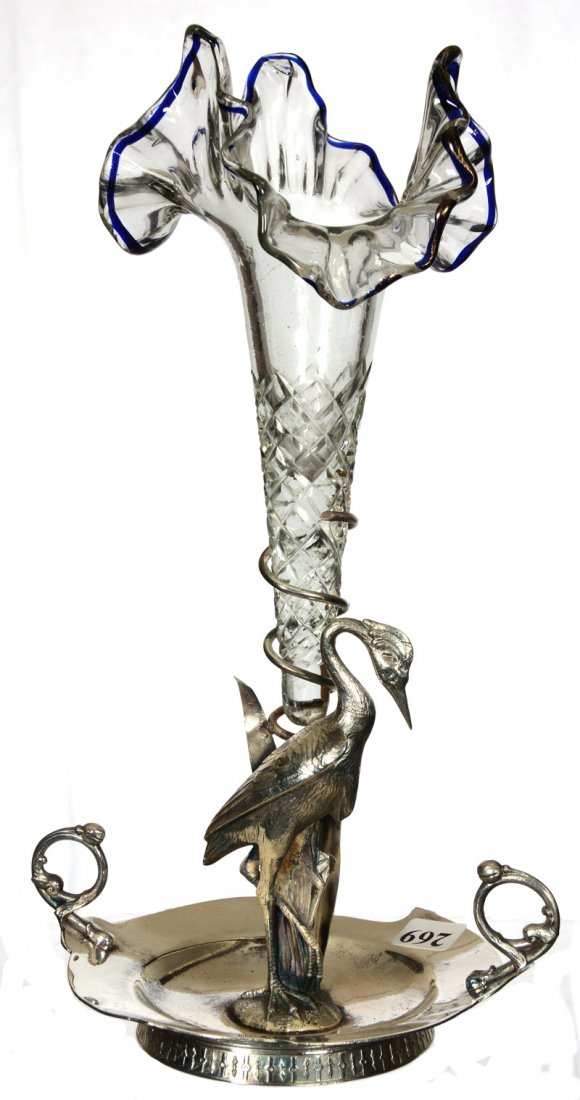 12" BUD VASE ON STAND: 12" BUD VASE ON STAND CLEAR TRI-CORNER RUFFLED ART GLASS VASE WITH BLUE RIM AND DIAMOND CUT BODY - SET ON MERIDEN SILVERPLATE STAND FEATURING STORK