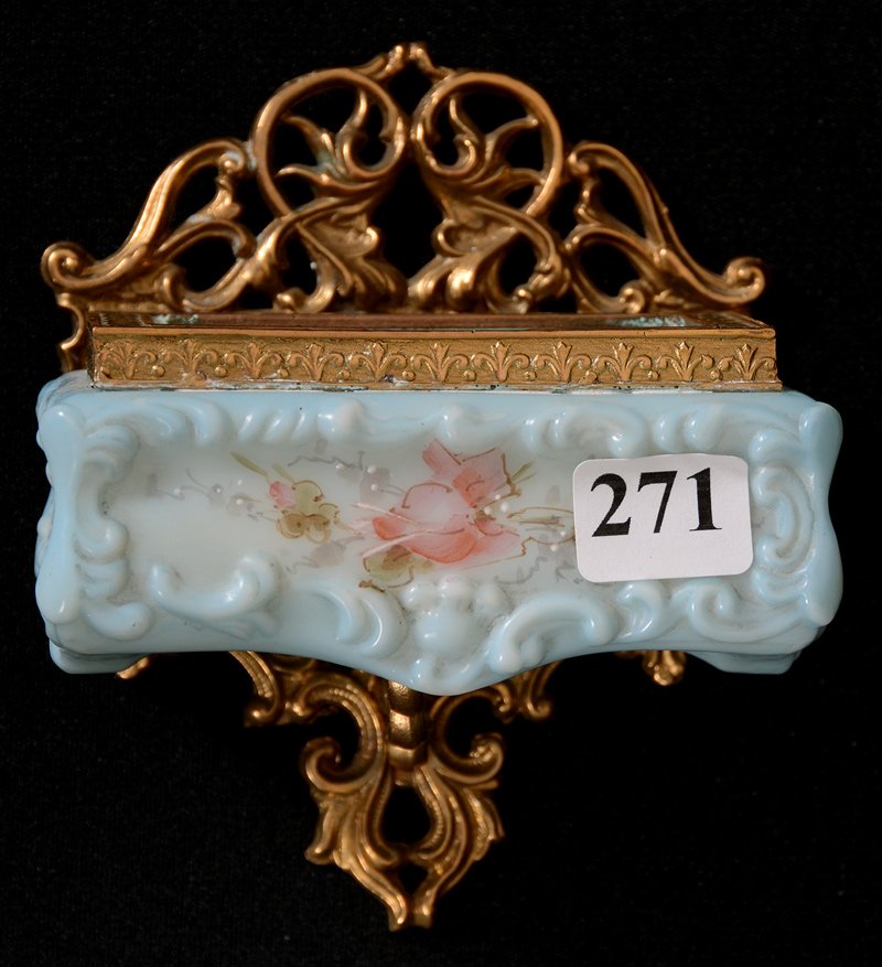 4 1/2" X 4" WAVECREST (BANNER MARK) WALL MOUNT MATCH: 4 1/2" X 4" WAVECREST (BANNER MARK) WALL MOUNT MATCH HOLDER BLUE TONES WITH PINK ROSE DECOR - GILT METAL FRAME - BACK LEFT CORNER HAS A HOLE