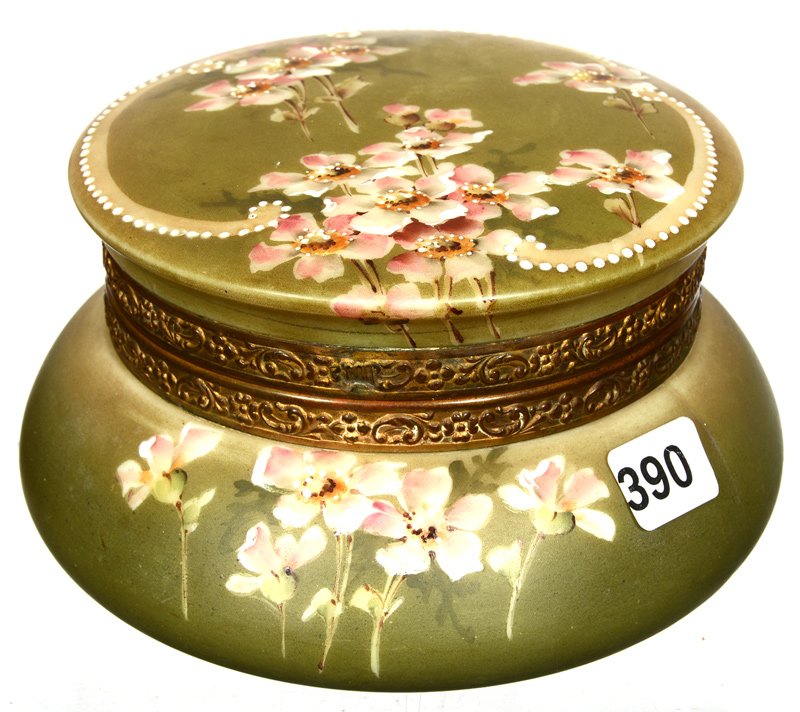 3 1/4" X 6" UNMARKED NAKARA ROUND HINGED JEWEL BOX WITH: 3 1/4" X 6" UNMARKED NAKARA ROUND HINGED JEWEL BOX WITH BEVELED INSET MIRROR GREEN BACKGROUND WITH PINK FLORAL DECOR AND WHITE ENAMEL BEADED HIGHLIGHTS