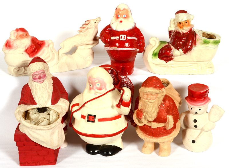 (7) VINTAGE AMERICAN MOLDED PULP SANTA CLAUS FIGURAL: (7) VINTAGE AMERICAN MOLDED PULP SANTA CLAUS FIGURAL CANDY CONTAINERS (2) WITH SLEIGHS - (1) SNOWMAN - VARIOUS FIGURAL SANTAS - SIZES RANGE FROM 5" TO 10"
