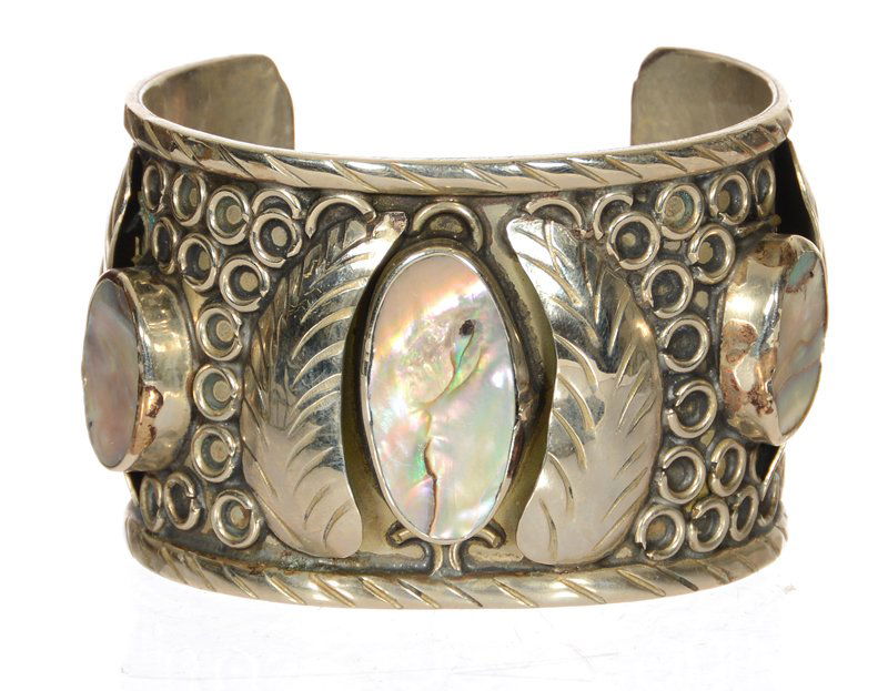 NATIVE AMERICAN MAN'S BRACELET: NATIVE AMERICAN MAN'S BRACELET SOLID SILVER WITH POLISHED ABALONE SHELL INSERTS - NO MAKER'S MARK VISIBLE - CIRCA 1950'SBracelet Measurement below:The opening measures: 1 3/8"The silver measures: 1 3/