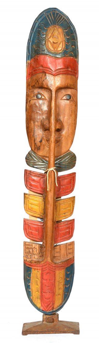 23" CARVED WOODEN ONE FACE TOTEM FROM YUKON TERRITORY: 23" CARVED WOODEN ONE FACE TOTEM FROM YUKON TERRITORY HIGHLIGHTED WITH BERRY DYES - CIRCA 1920'S - IRON BASE