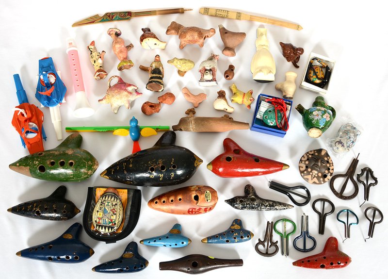 (2) BOXES OF POTTERY & STONE WHISTLES AND FLUTES: (2) BOXES OF POTTERY & STONE WHISTLES AND FLUTES NUMEROUS METAL JEWS HARPS - VIEW PHOTO FOR DETAILS