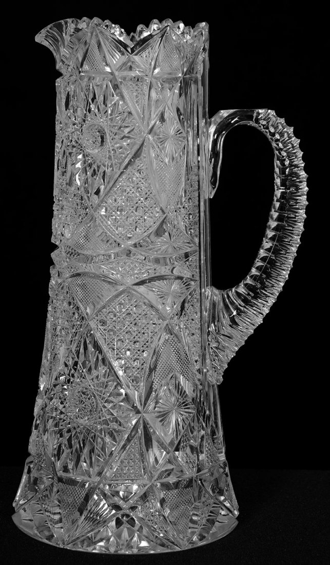 CHAMPAGNE PITCHER - 11 1/4": CHAMPAGNE PITCHER - 11 1/4" HOBSTAR, CANE, STRAWBERRY DIAMOND, VESICA, STAR AND FAN MOTIF - PENTA NOTCHED HANDLE - HOBSTAR BASE - VERY DEEP CUTTING - FEW SMALL BASE CHIPS