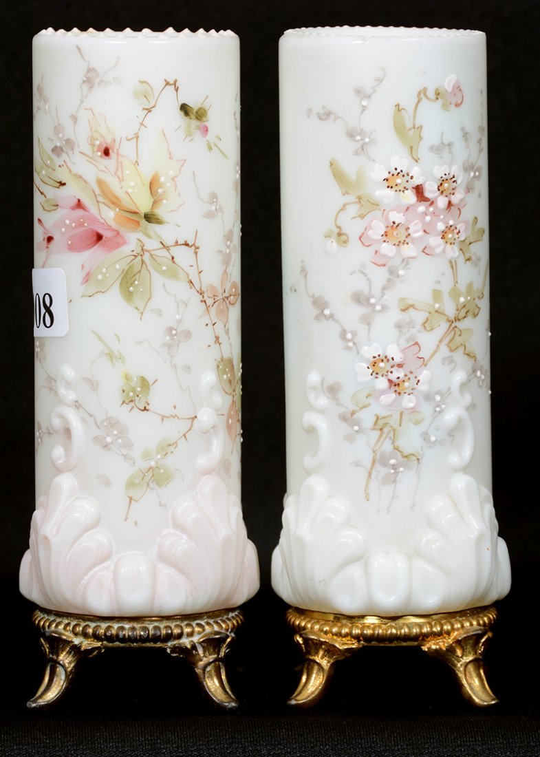 (2) 6" WAVECREST FOOTED CYLINDER VASES/HATPIN HOLDERS: (2) 6" WAVECREST FOOTED CYLINDER VASES/HATPIN HOLDERS (1) WHITE WITH BANNER MARK, PINK BLOSSOMS - (1) WHITE AND PINK, UNMARKED, PINK AND YELLOW ROSE DECOR
