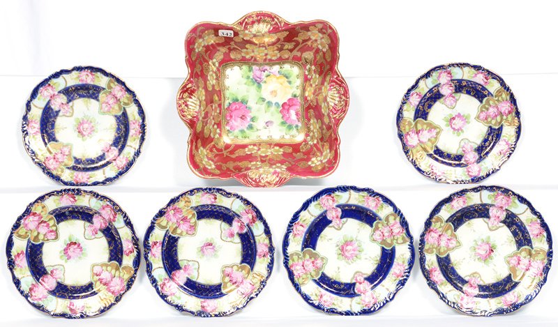 (7) NIPPON STYLE ITEMS: (7) NIPPON STYLE ITEMS (6) 7 1/2" COBALT BLUE AND WHITE PLATES WITH PINK FLORAL DECOR - (1) 10 1/4" SQUARE BOWL WITH MAROON BORDER AND ORNATE WHITE AND GOLD BLOSSOM HIGHLIGHTS