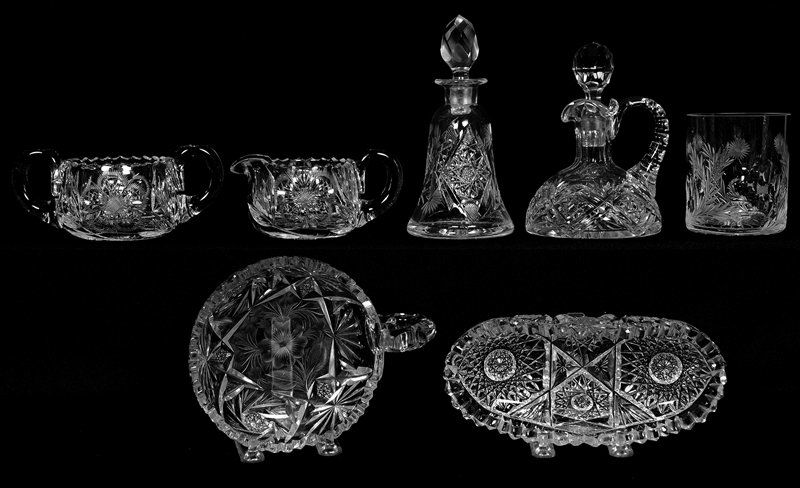 (7) AMERICAN BRILLIANT CUT GLASS ITEMS: (7) AMERICAN BRILLIANT CUT GLASS ITEMS (1) 7" FOLDED RELISH - (1) 5" ONE HANDLE NAPPY - (1) CUT & ENGRAVED CASTER BOTTLE - (2) CRUET BOTTLES - CREAMER & SUGAR SET (HANDLE ON SUGAR CRACKED)