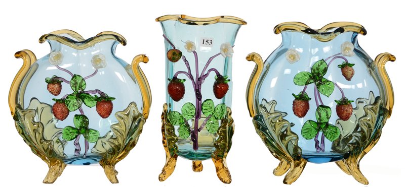 (3) STEVENS & WILLIAMS FOOTED ART GLASS VASES: (3) STEVENS & WILLIAMS FOOTED ART GLASS VASES (2) 10" MOON SHAPED TWO HANDLED - (1) 11" CLOVER SHAPED - ALL HAVE APPLIED STRAWBERRY AND BLOSSOM DECOR - (1) HAS REPAIR TO FOOT - (1) MISSING PORTION OF 