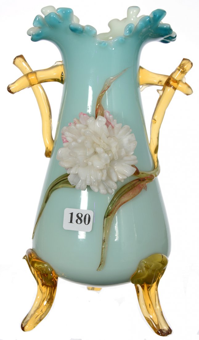 9 1/2" STEVENS & WILLIAMS CASED ART GLASS TWO HANDLED: 9 1/2" STEVENS & WILLIAMS CASED ART GLASS TWO HANDLED FOOTED VASE BLUE EXTERIOR - WHITE INTERIOR - AMBER FEET AND HANDLES WITH LARGE WHITE BLOSSOM DECOR - SMALL CHIPS ON BLOSSOM