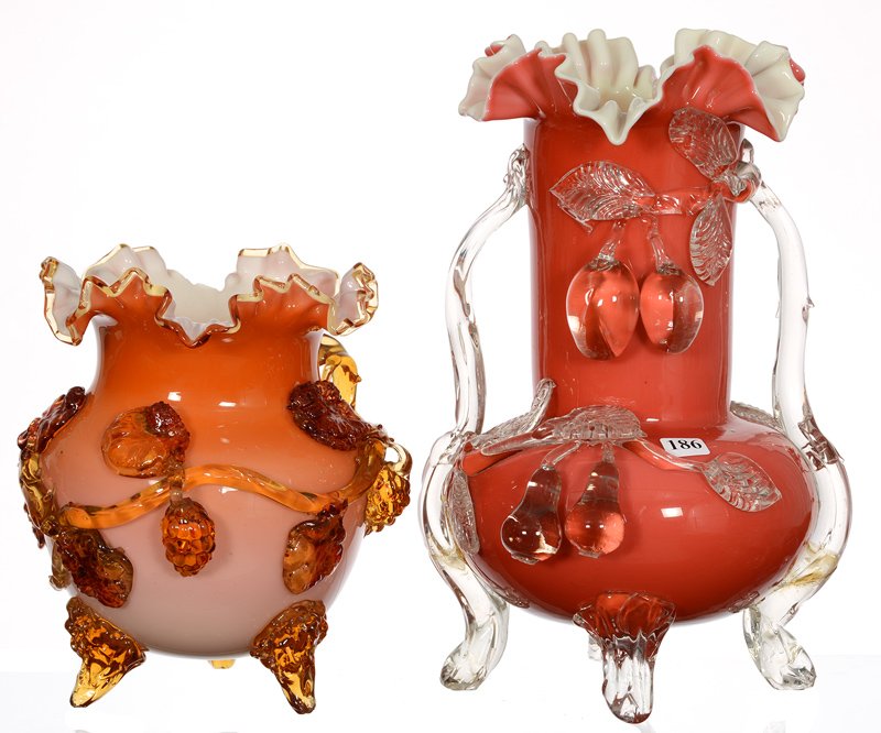 (2) STEVENS & WILLIAMS CASED ART GLASS FOOTED VASES: (2) STEVENS & WILLIAMS CASED ART GLASS FOOTED VASES (1) 13", PINK EXTERIOR WITH APPLIED CLEAR HANDLES AND FRUIT DECOR, FOOT REPAIRED - (1) 8 1/2" PEACH COLOR EXTERIOR WITH APPLIED VINTAGE MOTIF, LARGE