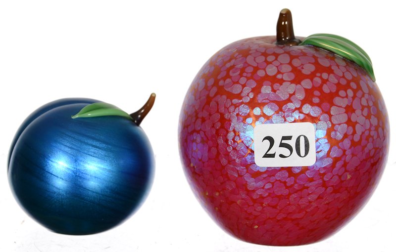 (2) MARKED ORIENT & FLUME PAPERWEIGHTS: (2) MARKED ORIENT & FLUME PAPERWEIGHTS (1) 3 1/2" RED IRIDESCENT APPLE - (1) 2" BLUE IRIDESCENT PEACH