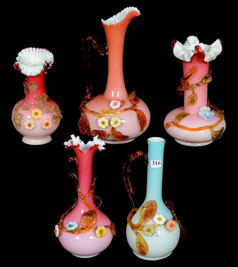 (5) STEVENS & WILLIAMS CASED ART GLASS ITEMS: (5) STEVENS & WILLIAMS CASED ART GLASS ITEMS (1) 11 1/2" HANDLED EWER, PINK EXTERIOR, WHITE INTERIOR (SMALL BRANCH FLAWS) - (1) 10" VASE (MINOR BRANCH FLAWS) - (1) 10" BLUE HANDLED EWER (SMALL CHIP ON