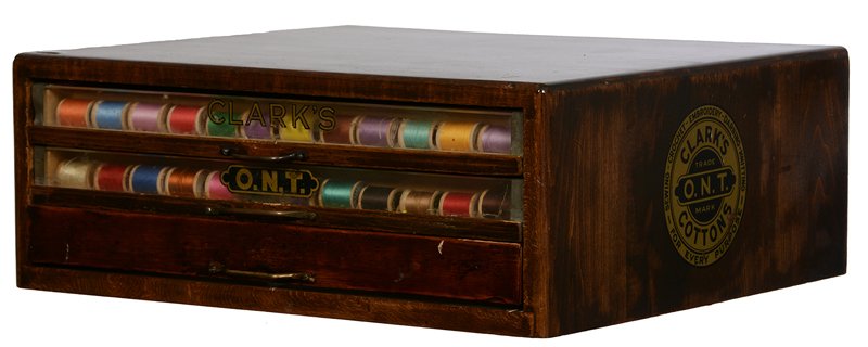 7" X 19 1/2" X 17" THREE DRAWER WOODEN ADVERTISING: 7" X 19 1/2" X 17" THREE DRAWER WOODEN ADVERTISING SPOOL CABINET ORIGINAL "CLARK'S" DECALS ON ALL FOUR SIDES - (2) DRAWERS HAVE GLASS FRONTS
