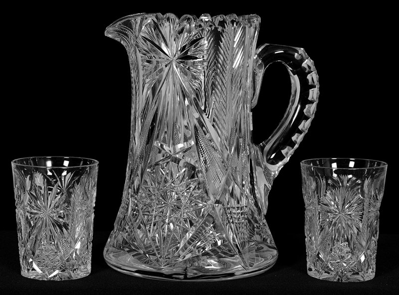 WATER SET - SIGNED LIBBEY: WATER SET - SIGNED LIBBEY (1) 9" X 7" PITCHER - HOBSTAR, NOTCHED FAN AND FEATHER MOTIF - TRIPLE NOTCHED HANDLE - RAY CUT BASE - (2) 4" MATCHING TUMBLERS - PATTERN SIMILAR TO NEOLA
