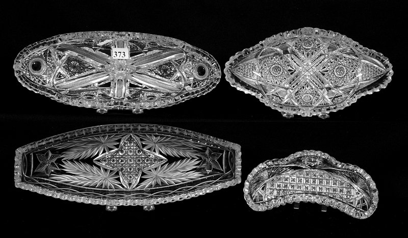 (4) RELISH AND/OR CELERY TRAYS - ABCG: (4) RELISH AND/OR CELERY TRAYS - ABCG (1) 12" CANOE SHAPED WITH FOUR POINT STAR CENTER AND ENGRAVED FLORAL HIGHLIGHTS - (1) 11 1/2" HOBSTAR, FEATHER AND FLASHED BULLSEYE ATTRIBUTED TO J. HOARE - (1) 9