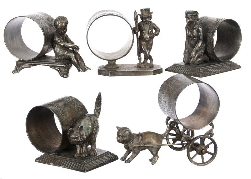 (5) Victorian Figural Silverplate Napkin Ring Holders -: (5) Victorian Figural Silverplate Napkin Ring Holders - (1) Pairpoint Sitting Child #3749; (1) Wilcox Child In Top Hat #4300; (1) Southington Scared Cat; (1) Southington Egyptian Woman; (1) Unmarked C