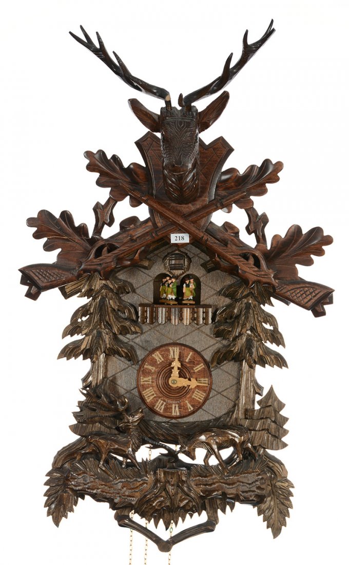 28" X 16" German Cuckoo Clock - Deer Head And Crossed: 28" X 16" German Cuckoo Clock - Deer Head And Crossed Firearms - Carved Scene Of Fighting Deer - Circa 1980's - Point On One Antler Of Large Center Deer Is Missing - Antler Of One Of Smaller Side Deer